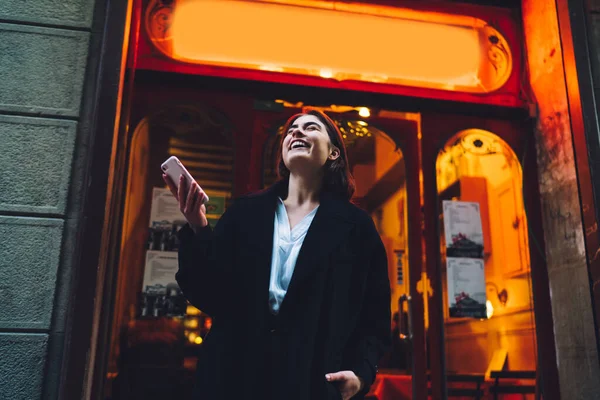 Low Angle Cheerful Laughing Female Trendy Wear Browsing Mobile Phone — Stock Photo, Image