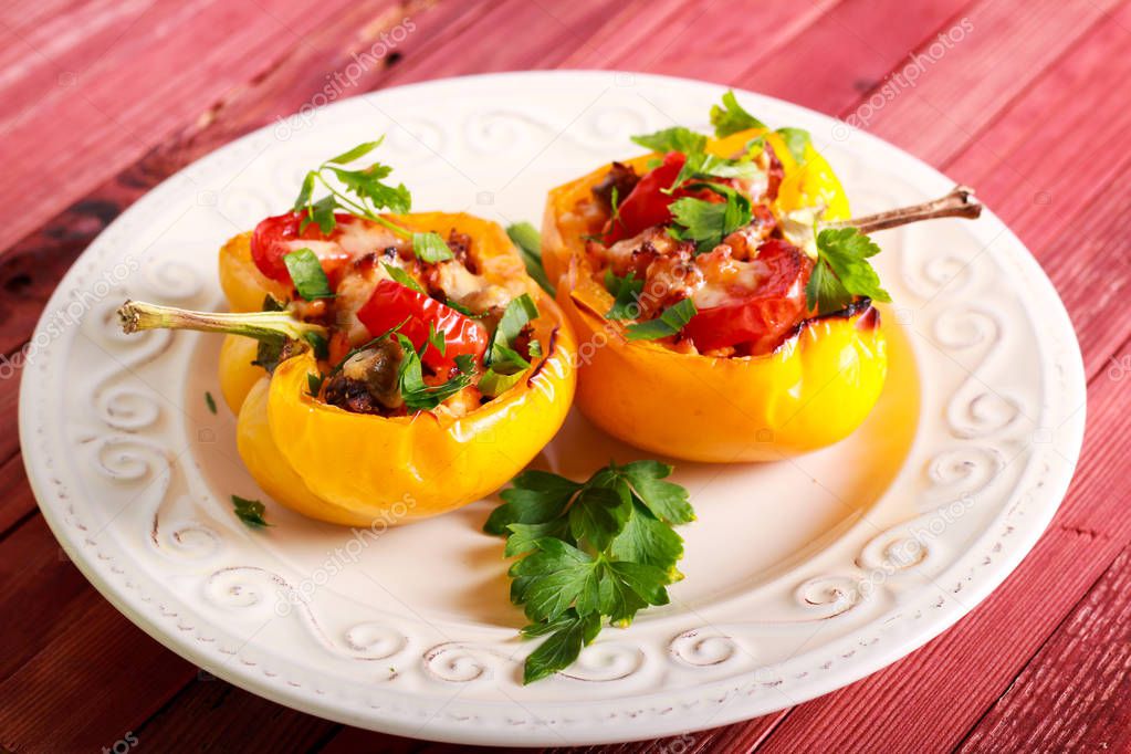 Yellow bell pepper stuffed with chicken fillet, tomato and cheese