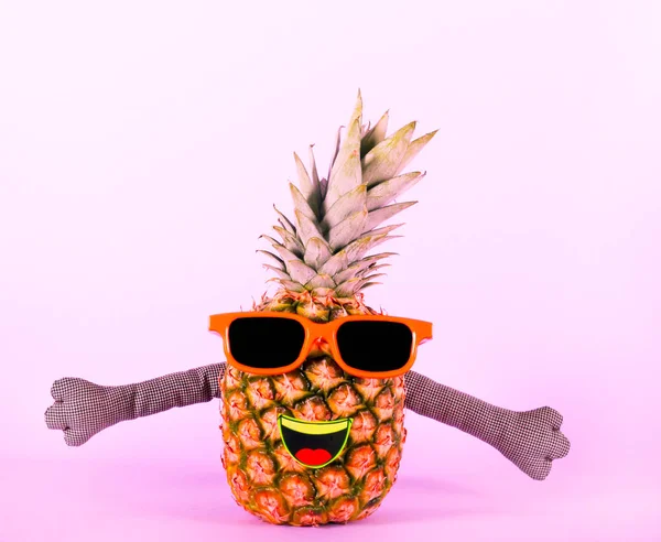 Pineapple in sunglasses - party, fun concept over colorful background
