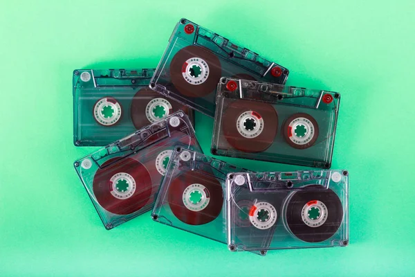Retro audio cassettes over green background
