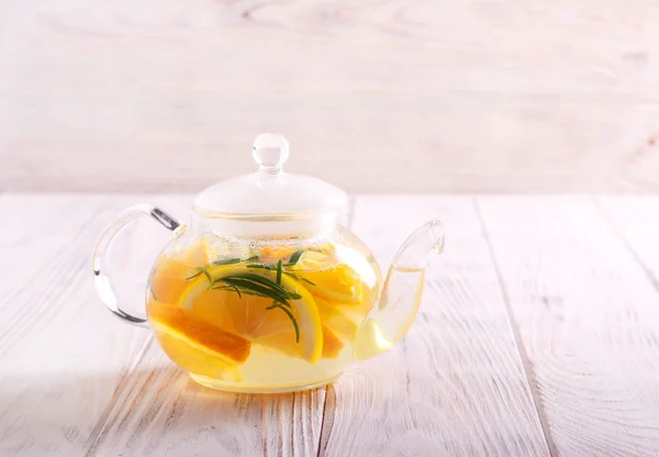 Citrus and rosemary tea in a teapot — Stock Photo, Image