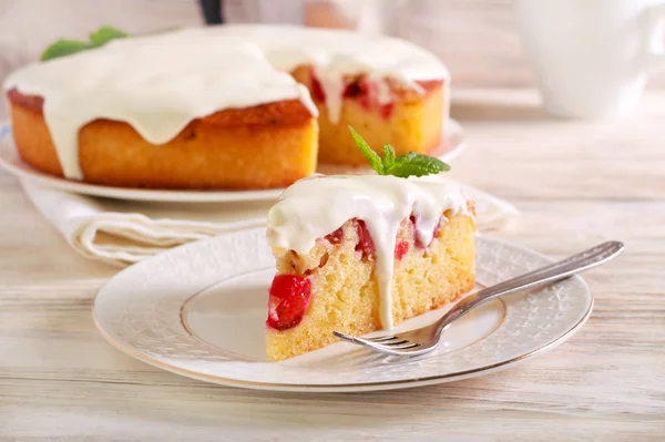 Cherry cake with cream topping — Stock Photo, Image