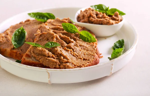 Chicken liver pate over bread slices — Stock Photo, Image