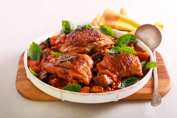 Chicken thighs with eggplant and carrot — Stock Photo, Image