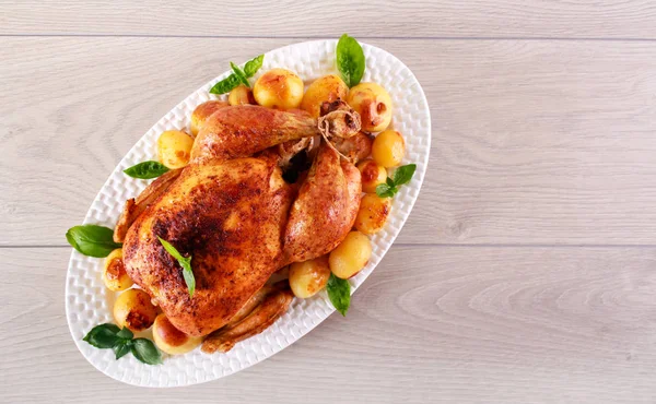 Roast whole chicken with potatoes