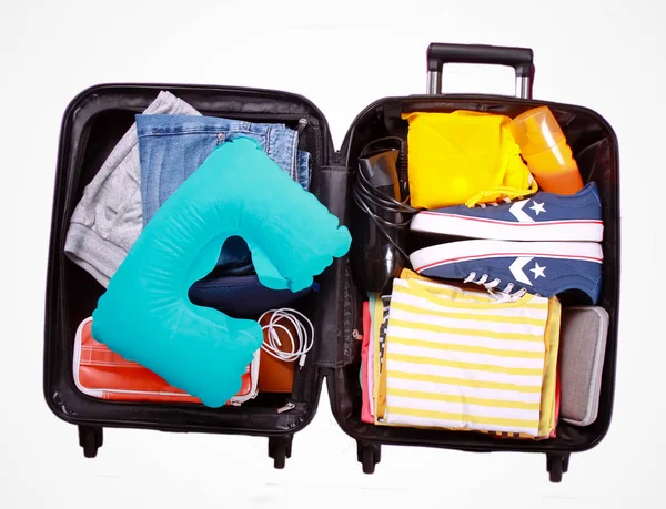 Packed suitcase over white background — Stock Photo, Image