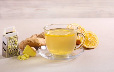 Lemon and ginger detox healthy tea, served clipart
