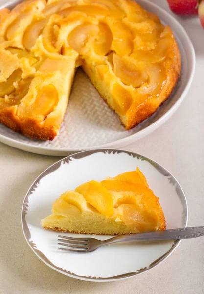 Apple upside down sponge cake, served on plate