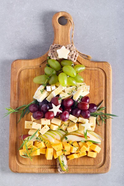 Christmas cheese board,  assortment of different cheese and fruits