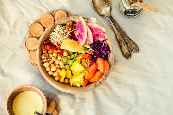 Healthy vegan lunch/dinner bowl in wooden dishes