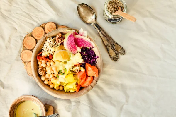 Healthy vegan lunch/dinner bowl in wooden dishes