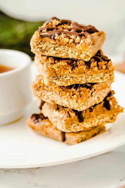 Granola Bars, Healthy Homemade Snack, Superfood Bars with Cranberry, Pumpkin Seeds, Oats, Chia and Flax Seed on bright background, Vegan Meal.Close-up.Selective focus