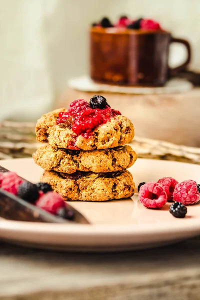 Oatmeal cookies with raspberry jam and date caramel. Close-up.Ki