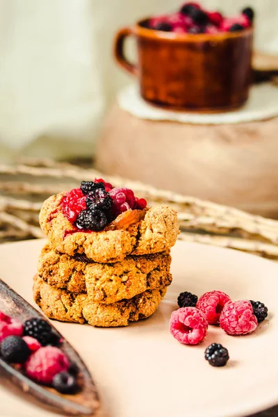 Homemade vegan crunchy oatmeal cookies with raspberry jam and da