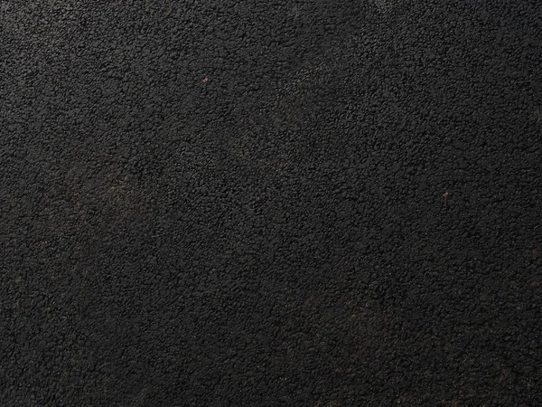 Cuir noir brut de l'atelier du tailleur - texture rugueuse de la peau — Photo