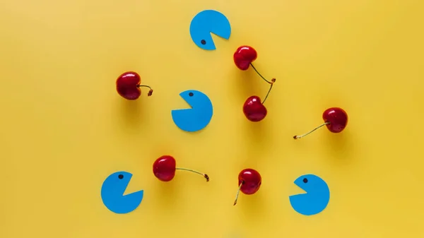 Blue Figures Trying Eat Cherries — Stock Photo, Image