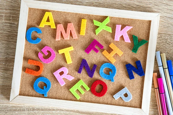Colorful ENGLISH alphabet on a pin board background, English la — стоковое фото