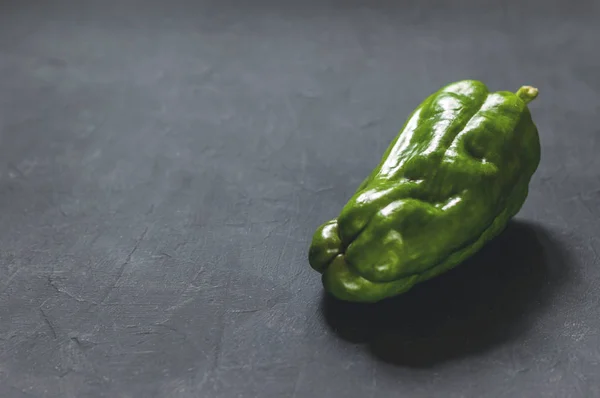 Green pepper on black background — Stock Photo, Image