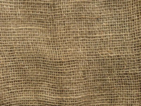 Kahverengi çuval bezi arka planı. Eski doku eko atık geri dönüşüm kavramı.