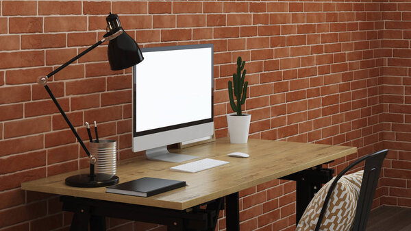 Workplace with a computer. Interior with brick wall. 3D rendering.