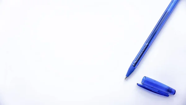 blue ballpoint pens on a white background