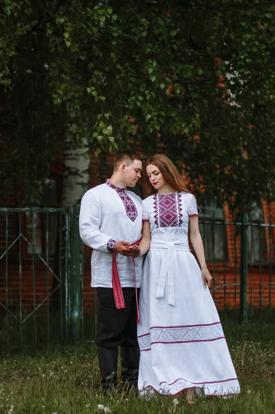 Reconstruction of traditional Russian dresses. Lovers in nature