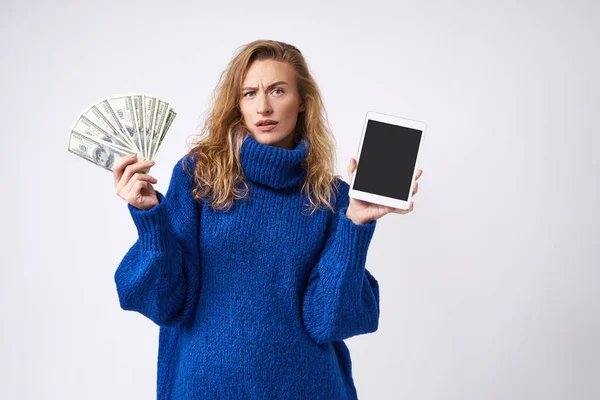 Dissatisfied Curly Blonde Tablet Money Hands White Background Blue Sweater — Stock Photo, Image