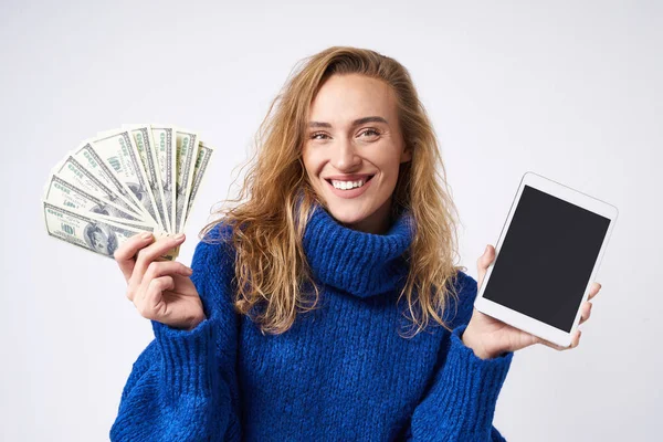 Happy Blonde Blue Sweater White Background Tablet Money Hand — Stock Photo, Image