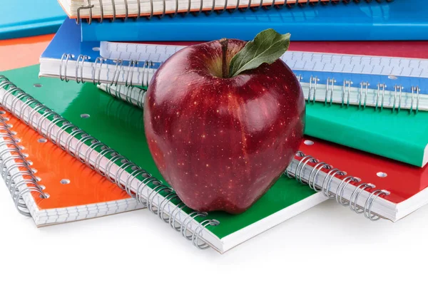 Notebooks and red apple. — Stock Photo, Image