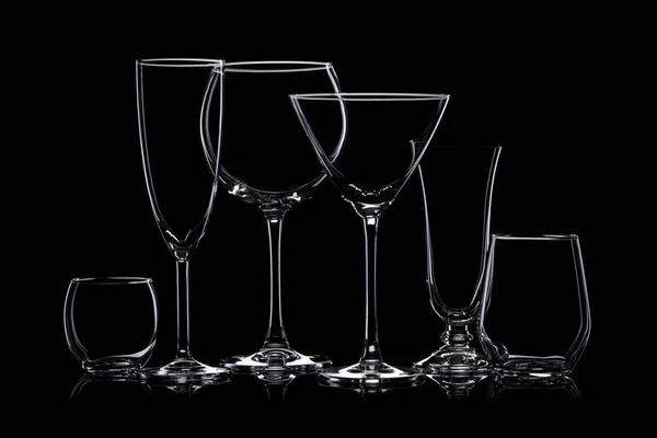 Glassware silhouettes on black. — Stock Photo, Image