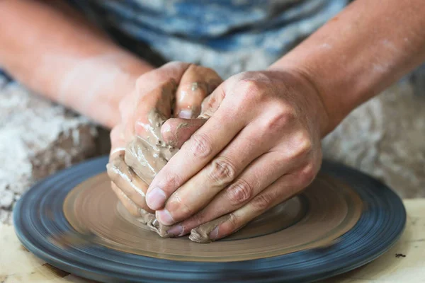 Stock image Potter hands making in clay on pottery wheel. Potter makes on the pottery wheel clay pot.