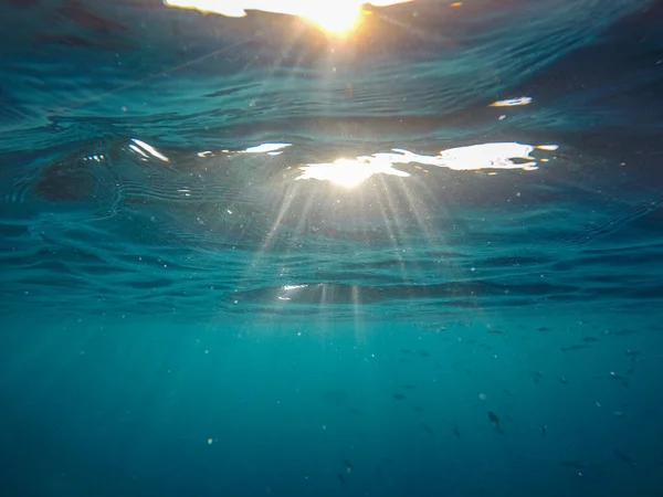 Sunbeams seem underwater while snorkeling