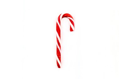 Beyaz arka planda Noel için lezzetli bir baston şeker.