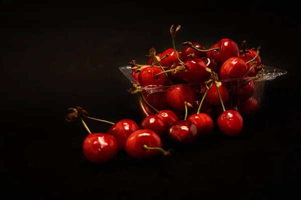 Container Fresh Cherries Black Background — Stock Photo, Image