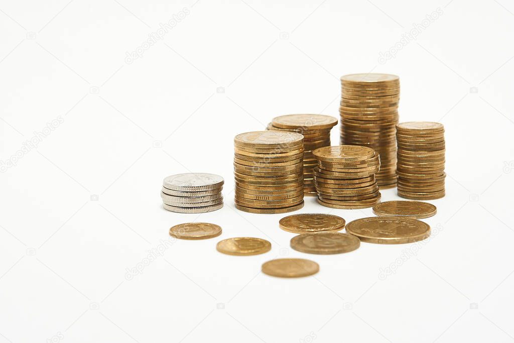 Stacks of coins on a white background.