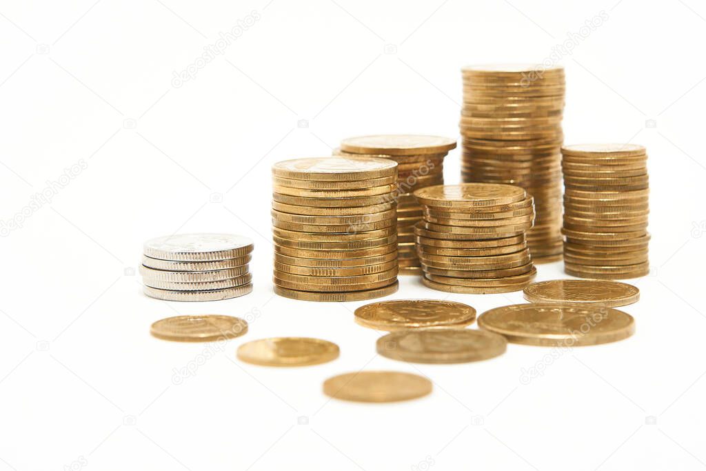 Stacks of coins on a white background.