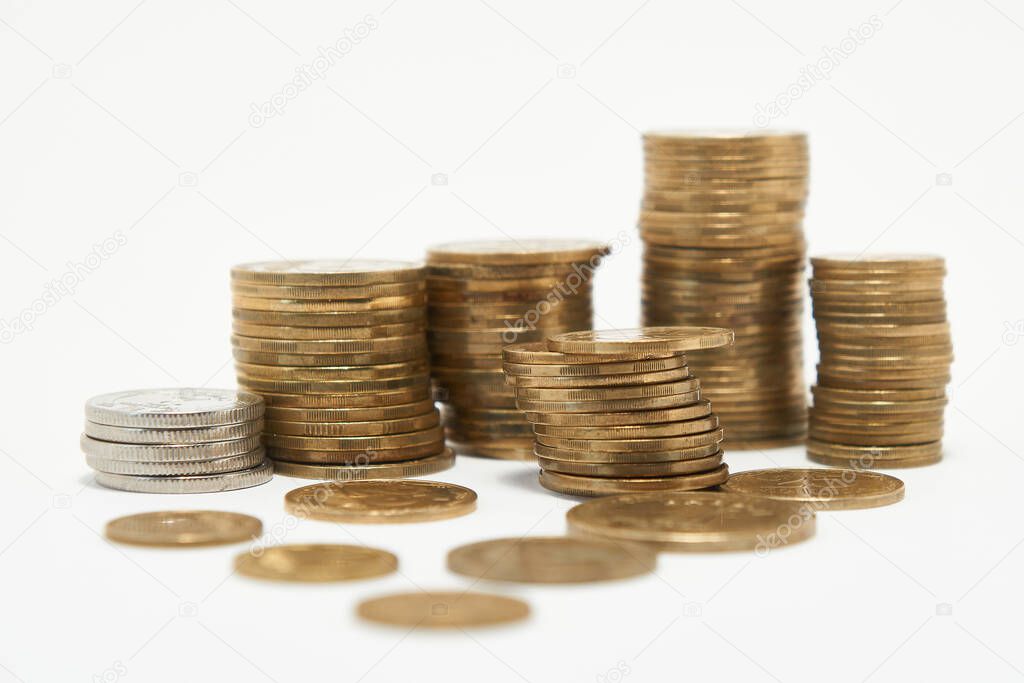 Stacks of coins on a white background.