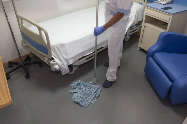 Cleaning staff cleaning hospital rooms