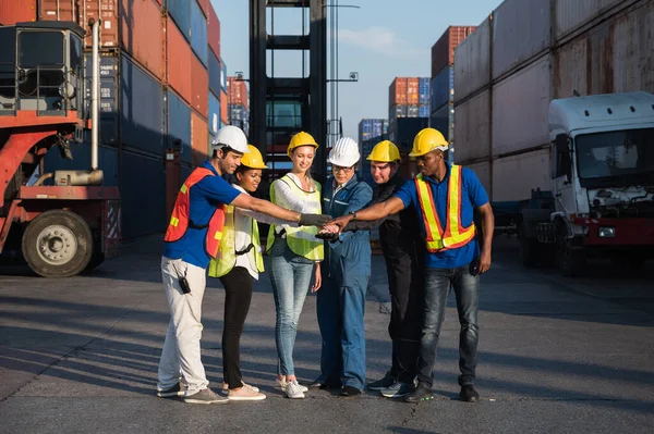 Group of foreman man & woman worker working checking at Container cargo harbor to loading containers. Dock male and female staff business Logistics import export shipping concept.