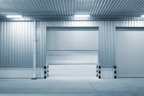 Shutter door or roller door and concrete floor outside factory building use for industrial background.