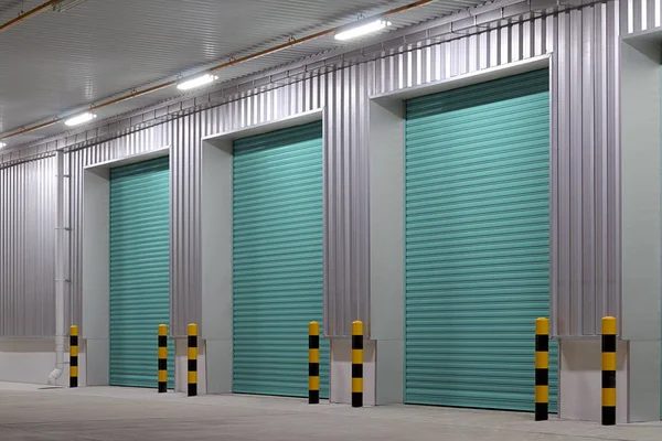 Shutter door or roller door and concrete floor outside factory building use for industrial background.