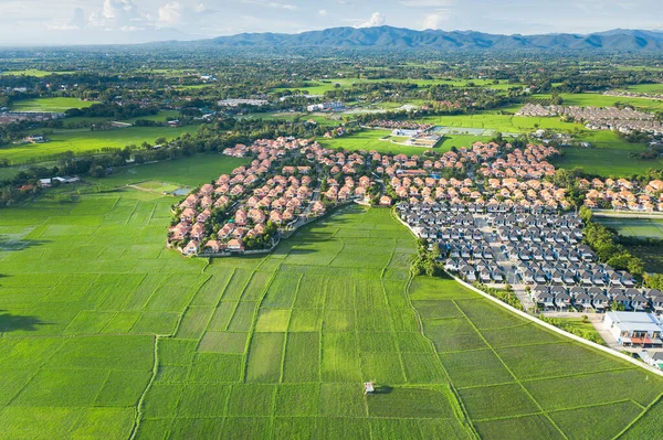 Housing subdivision or housing development. Also call tract housing. Large tract of land that divided into smaller. Business process by developer and builder. Aerial view in Chiang Mai of Thailand.