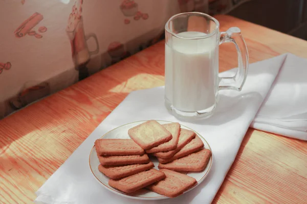 Cozy morning breakfast with biscuit and milk