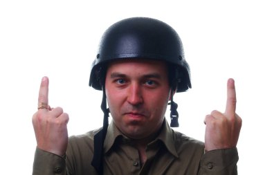 A man in a helmet shows with two hands a gesture of fuck middle finger up, on a white background. The concept of disagreement and rejection
