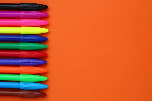 Multicolored felt-tip pens and space for text or lettering.