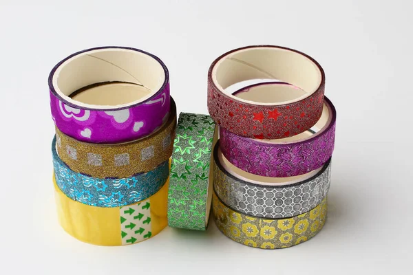 Rolls with scotch tape and decorative adhesive tapes for decorating gifts for the holidays. Background