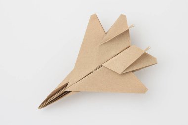 Origami kağıt uçak modeli. Seçici odaklanma. Hafif arkaplan