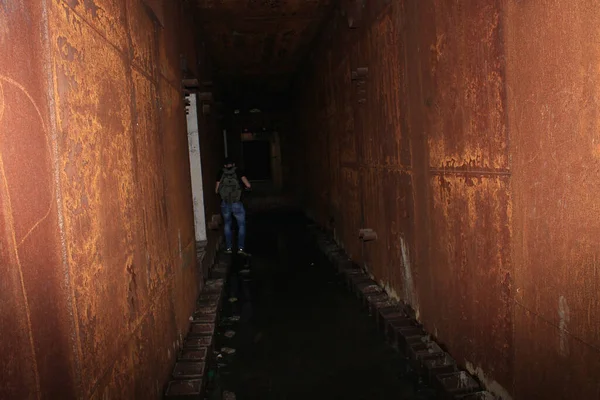 Dark underground corridors of an abandoned shelter. The largest secret facility of the USSR is the anti-nuclear bunker 1180. Moldova Oliscani, Soldanesti district.