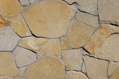 Duvar dekoratif yabani taştan yapılmıştır. Arkaplan veya grafik kaynağı.