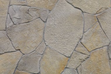 Duvar dekoratif yabani taştan yapılmıştır. Arkaplan veya grafik kaynağı.